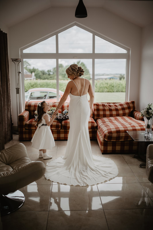 Wedding morning at home, bride and daughter in their dresses. Photographer Mario Vaitkus, Galway City