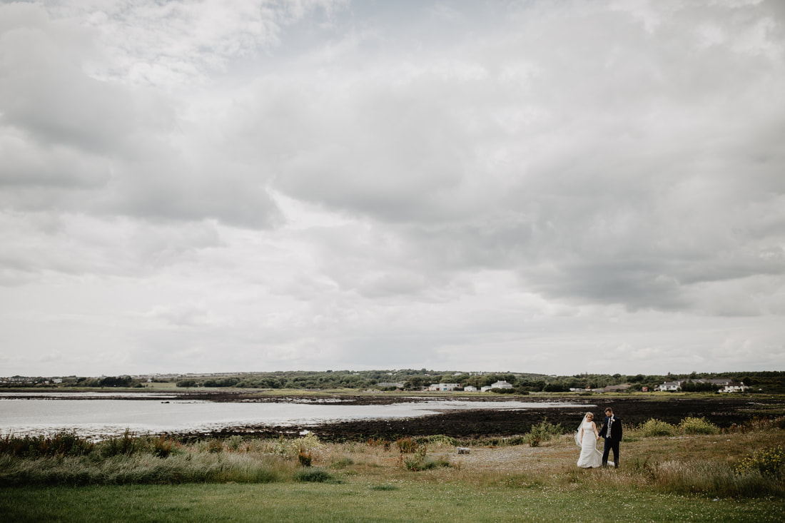 Bride and groom at a beach in Galway City
