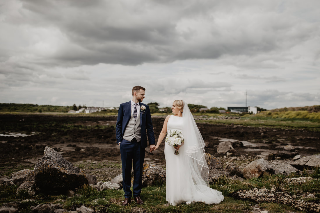 Bride and groom on a shore in Galway