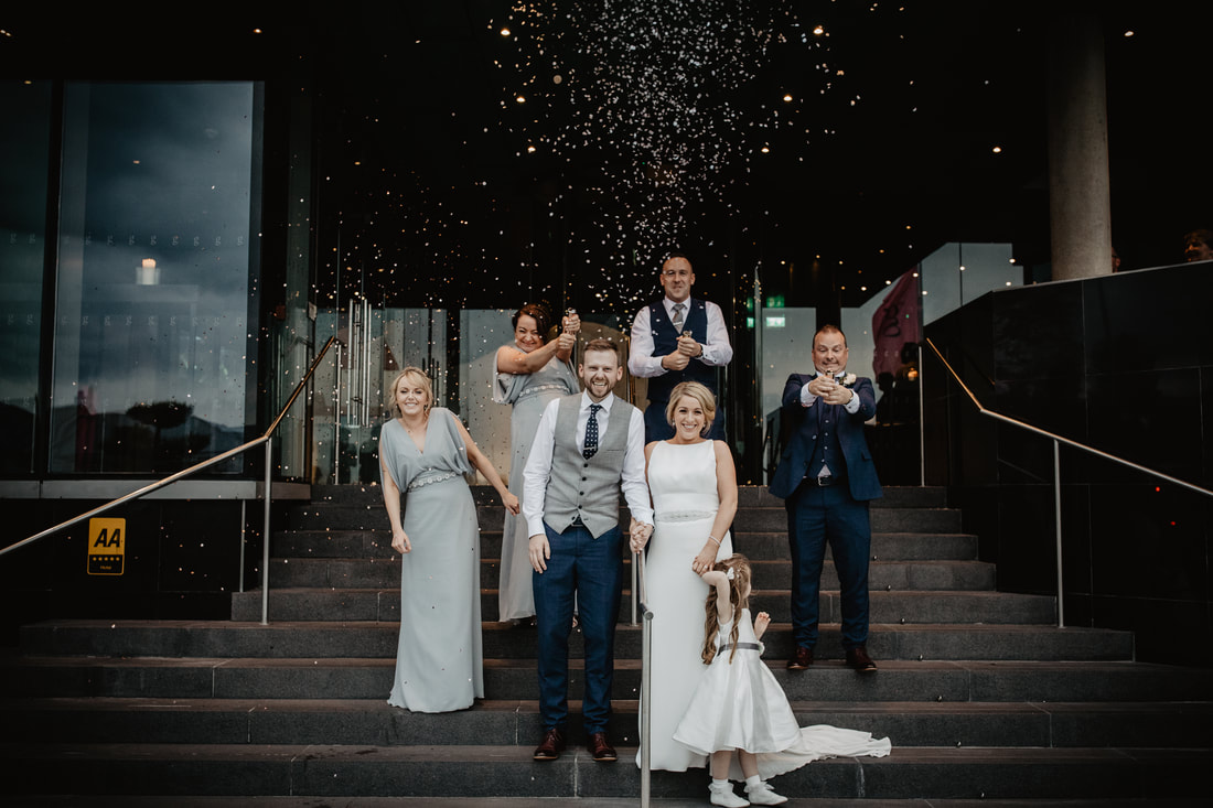 Wedding Confetti, bride and groom , bridal party. Front entrance to The G Hotel, Galway