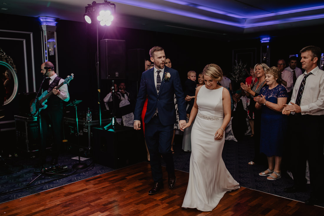 Bride and groom entering for first dance at The G Hotel, Galway 