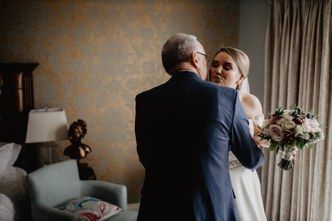 Bride and Father hug, at Clanard Court Hotel, Athy, Co. Kildare by wedding photographer Mario Vaitkus