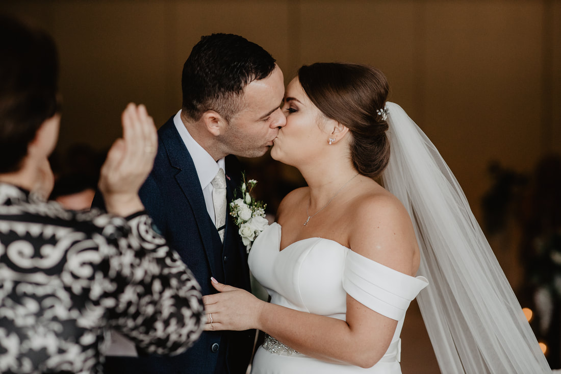 First kiss, at Clanard Court Hotel, Athy, Co. Kildare by wedding photographer Mario Vaitkus