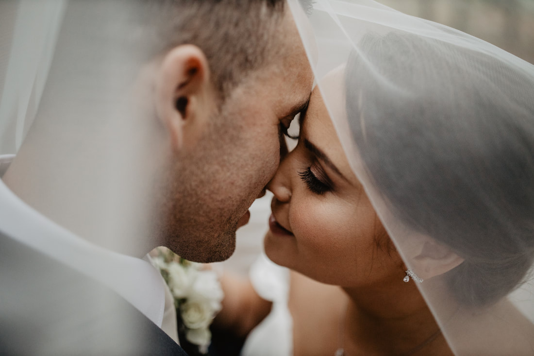 Bride and groom kissing. Wedding photographer in Kildare Mario Photo - Video Production