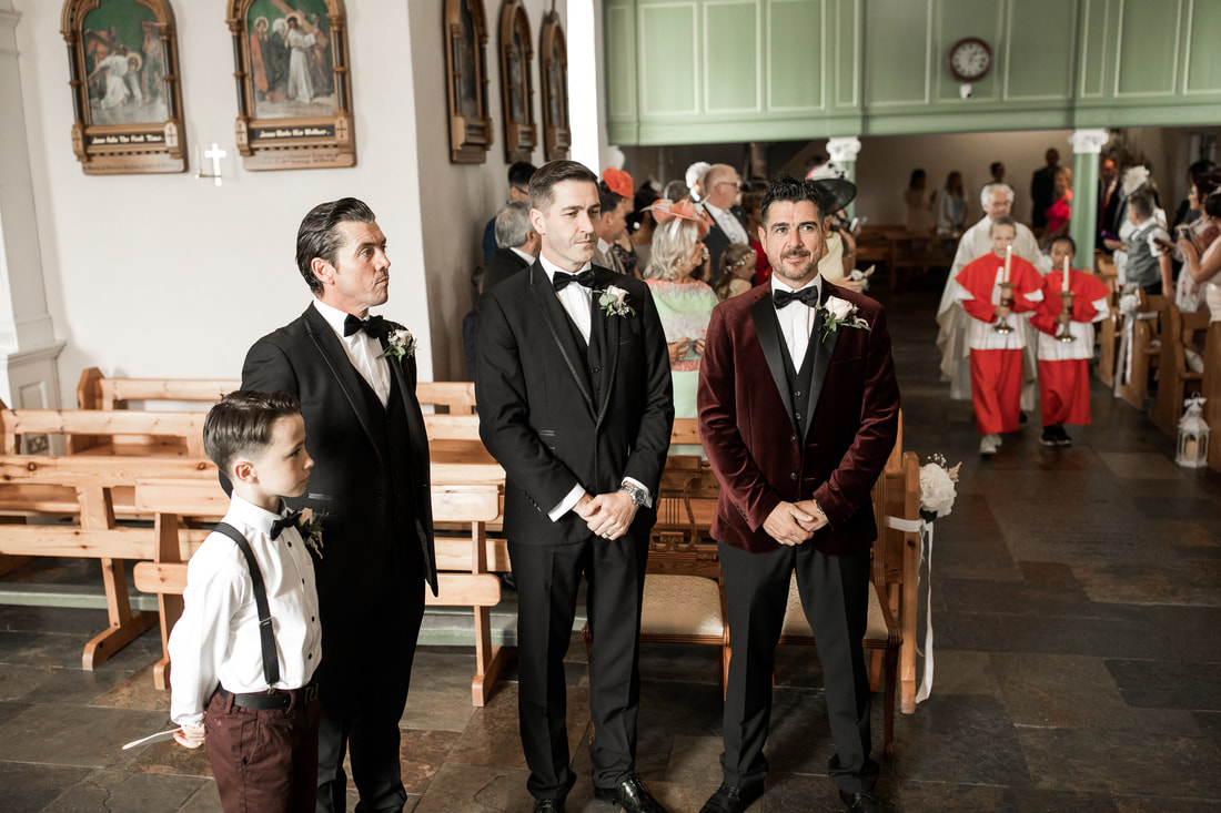 groom and groomsmen at a church in Carlingford