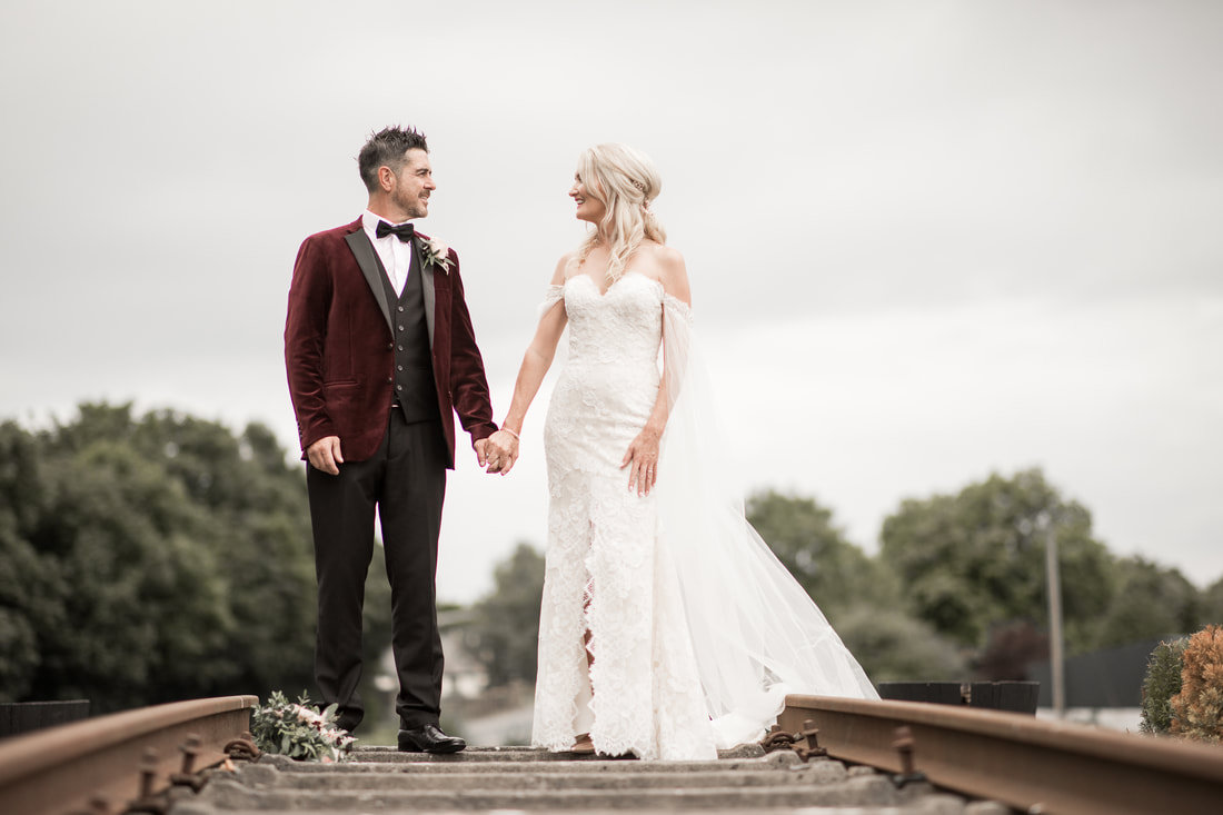 Bride and groom on a railway in Carlingford