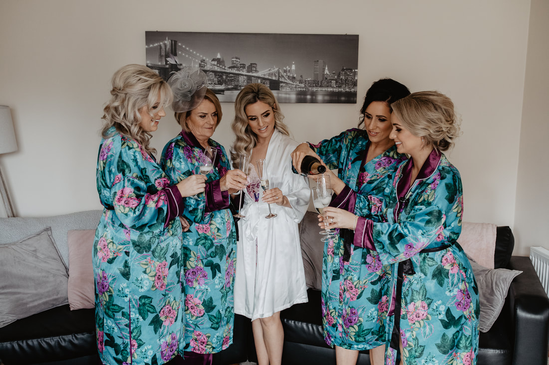 Bridesmaids getting their champagne 