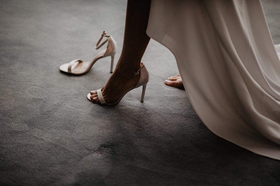 Stunning image of bride stepping into shoe. Wedding at Knightsbrook Hotel