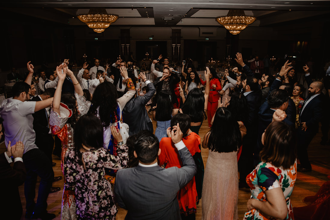 Asian wedding dancing at a wedding in Ireland. Photographer Mario