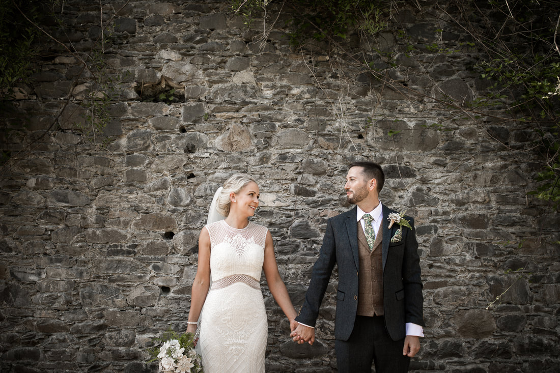 Creative wedding photo at Bellingham castle by Mario Photo Video Production