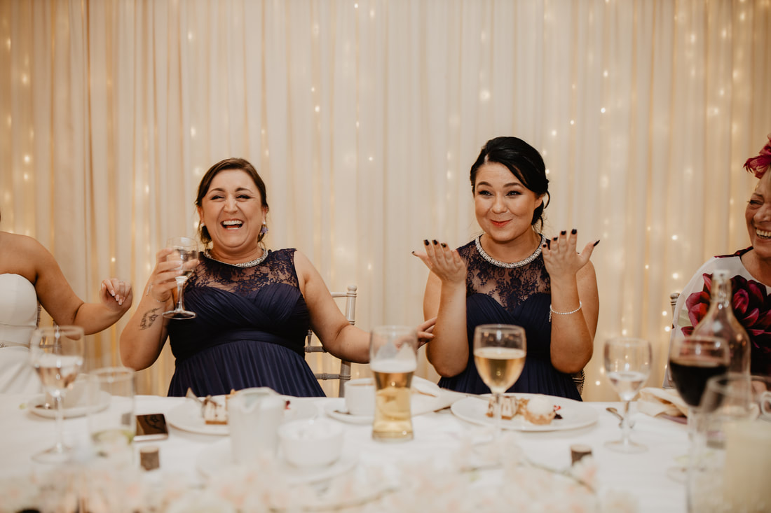 Bridesmaids having fun at a table. Wedding photographer in County Kildare Mario Vaitkus
